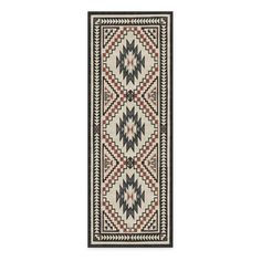 a rug with an intricate design on the front and back side, in black and white