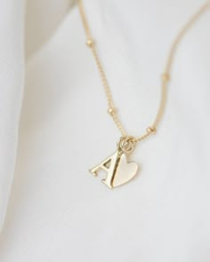 Personalized 14k solid gold initials necklace with beautiful beaded chain. Simple, minimalist everyday necklace.Perfect wearing alone or layering with your favorite necklaces. Each initial measures approx. 7mm You can add up to 5 Initials (Heart counts as ONE initial ) 16" or 18" Bead Chain 14k Gold * Leave us your initials and placement in the comment box at checkout. Tiny Diamond Necklace, Initials Necklace, Gold Initial Necklace, Jewelry Accessories Ideas, Initial Necklace Gold, Mom Jewelry, Initial Jewelry, Everyday Necklace, Gold Initial