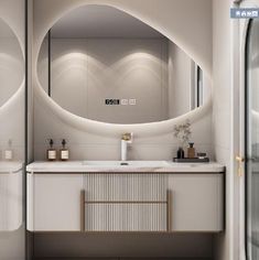 a bathroom with a large mirror above the sink