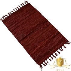 a brown rug with fringes on it