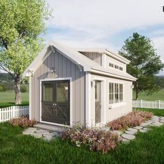 a small shed with a door and windows in the grass next to a white picket fence