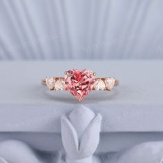 Art Deco Heart Cut Peach Pink Sapphire Engagement Ring Rose Gold Unique Five Stone Love Rings for Women Moissanite Anniversary Gift for Her PRODUCT SUMMARY Metal Type: Solid yellow, white or rose gold,10k/14k/18k gold. Size: All sizes are available, contact me if they do not contain the size you want in the drop-down menu. ☪☪Engagement ring ⚜Center Stone - Lab grown Peach Pink Sapphire Cut - Heart Shaped Size - 7x7mm ⚜Side Stone - Moissanite Cut - Heart  ⚜Band width - about 1.6mm IMPORTANT INFOR Pink Sapphire Engagement Ring Rose Gold, Art Deco Heart, Sapphire Engagement Ring Rose Gold, Pink Stone Engagement Rings, Rose Gold Heart Ring, Pink Rings, Pink Sapphire Engagement Ring, Cute Promise Rings, Pink Engagement