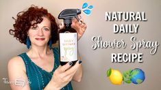 a woman is holding a bottle of shower spray with the words natural daily on it