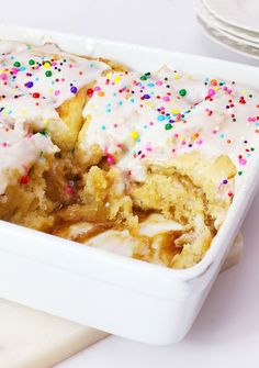 a close up of a cake in a pan with sprinkles on it