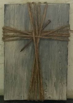 a cross made out of wood and rope