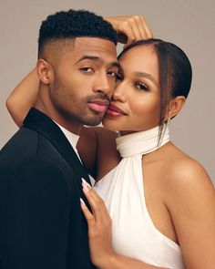 a young man and woman posing for a photo with their heads close to each other