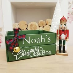 a wooden crate with christmas decorations and a nutcracker figurine next to it