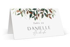 a place card with leaves on it