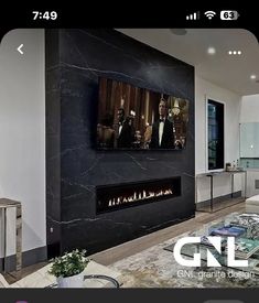 a living room with a large fireplace and tv mounted to it's side wall