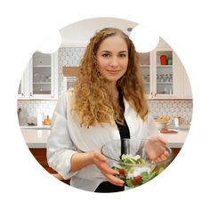 a woman is holding a salad in a bowl