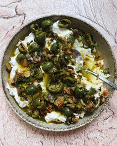 a bowl filled with food on top of a table