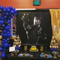 a batman birthday party with balloons and decorations