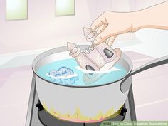 a person is stirring something in a pot on the stove