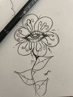 a drawing of a flower with an eye on it