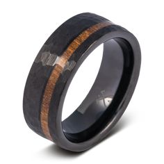 a black ceramic ring with wooden inlays