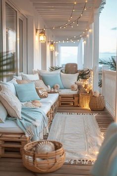 a porch covered in lots of pillows and blankets