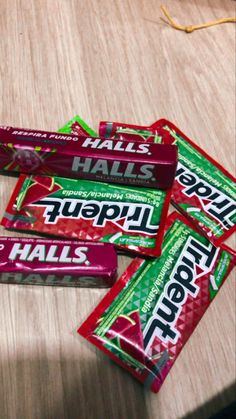 four bars of candy sitting on top of a wooden table