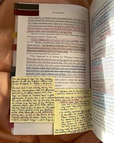 an open book with sticky notes attached to it