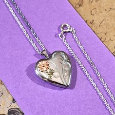 ♥Endearing vintage sterling silver heart shape locket pendant measuring approximately 1 inch by 3/4 inches. The chain is 20 inches long with a spring ring clasp and is a dainty loose weave rope chain. This locket has floral accents in rose and yellow gold (black hills gold colors). It is in very good to excellent pre-owned condition. This locket is sure to delight its recipient and can be a gift for so many occasions including the remembrance of a loved one, a going away gift, holiday, birthday, or anniversary gift, or just because.  To see more vintage lockets in my shop, please click here: https://www.etsy.com/shop/JulesBaublesandMore?ref=seller-platform-mcnav&section_id=40120424 Stand out from the crowd just a little bit more by purchasing and wearing accessories that are uncommon, uniq Heart Shape Locket, Vintage Lockets, Black Hills Gold, Antique Brooches, Gold Colors, Photo Locket, Photo Vintage, Upcycled Jewelry, Black Hills