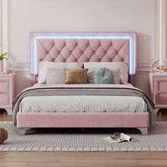 a bed with pink upholstered headboard and foot board in a white room