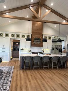 a large kitchen with an island in the middle and lots of counter space on each side