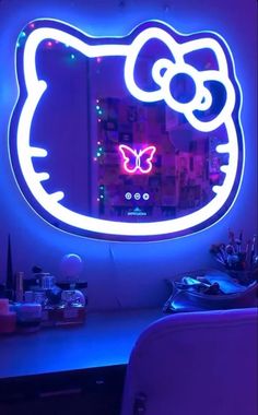 a hello kitty light up mirror in the shape of a butterfly