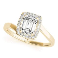 an emerald cut diamond ring set in rose gold with diamonds around the band and shoulders