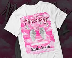 a t - shirt that says in loving memory with two angel wings on the front