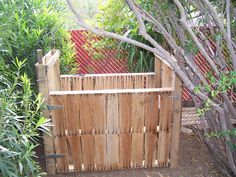 a wooden fence with the words pallet compostt bin in front of it