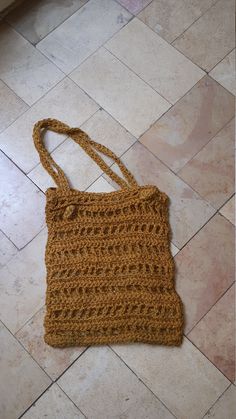 This is a hand made vintage 70s macrame bag, colour is a brown yellow Good condition a bit of dirt on the bottom,  i assume it is hand washable Brown Open Weave Crochet Tote Bag, Yellow Woven Crochet Tote Bag, Bohemian Hand-knitted Brown Shoulder Bag, Bohemian Brown Hand-knitted Shoulder Bag, Bohemian Brown Hand Knitted Shoulder Bag, Macrame Crochet Tote Bag For Shopping, Brown Hand-knitted Crochet Tote Bag, Crochet Macrame Tote Bag For Shopping, Brown Crochet Macrame Bag For Everyday Use