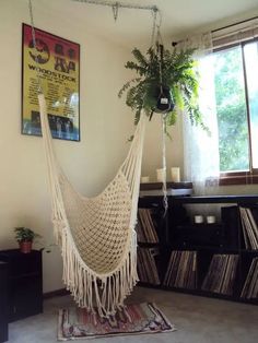 there is a hammock hanging in the room