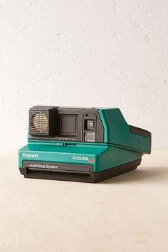 a polaroid camera sitting on top of a table