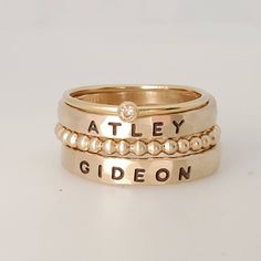 Thick gold filled name rings, 14k gold filled name ring set, chunky name ring set, Mother's ring, stackable name rings These 3mm name rings are handmade in our Indiana studio. Each engraved ring starts from a spool of wire. They are handcut, handformed and soldered in the first process of creating your ring. They are then hammered to size, engraved, handbrushed, and polished. Each ring will have a small solder spot in the back because they are handmade, not machine made. We use yellow gold solder on our yellow and rose gold filled rings because rose gold solder contains carcinogens. The rings are very unique. There may be slight color variations between the solder and the metal on the ring. These rings are individually made for you and no two are alike- they will not fade like plated! Plea Mom Rings, Thick Stacking Ring, Name Rings Silver, Stackable Name Rings, Set Of Rings, Mothers Day Rings, Multiple Rings, Ring Spacer, Mom Ring