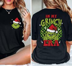 In My Grinch Era Two sided Christmas Shirt, Retro Grinch Era christmas shirt, Merry Christmas T-Shirt, Merry Grinchmas Tshirt 1. Adult Tshirt Unisex Jersey Short Sleeve Tee - 100% Airlume combed and ringspun cotton (fiber content may vary for different colors): Solid colors are 100% cotton except Ash - 99% cotton and 1% polyester, heather colors are 52% cotton, 48% polyester (Athletic Heather and Black Heather are 90% cotton, 10% polyester) - Light fabric (4.2 oz/yd² (142 g/m - Retail fit - Tear Resting Grinch Face Long Sleeve Shirt, Whoville Christmas Shirts, Mr And Mrs Grinch Shirts, In My Grinch Era, Grinchmas Tshirt, Grinch T Shirt, Whoville Christmas, Merry Grinchmas, Christmas T Shirt