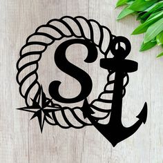 the monogrammed letter s is made out of rope and an anchor with leaves