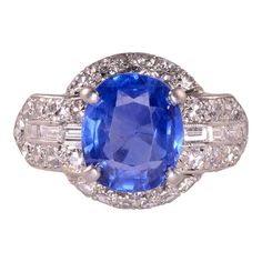 This is part of Chairish’s Fine Jewelry assortment.  Vintage 3.60 carat oval sapphire and diamond platinum ring, circa 1930. This platinum ring has one center oval sapphire at 3.60 carats. The vintage sapphire ring is accented with 36 single cut diamonds at 0.86 carat total weight having VS1 clarity and F-G color, along with six baguette diamonds at 0.28 carat total weight having VS1-2 clarity and G-H color. This vintage sapphire and diamond ring is a size 6.5. Please note that the sapphire was Platinum Sapphire Ring, Vintage Sapphire Ring, Diamond Platinum Ring, Platinum Diamond Rings, Vintage Sapphire, Sapphire And Diamond Ring, Roberto Coin, Platinum Ring, Sapphire Stone