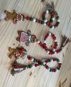 christmas decorations are arranged on a wooden table with the word go spelled out in letters