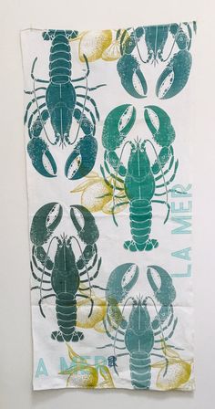 a piece of cloth with lobsters on it and the words new law printed on it