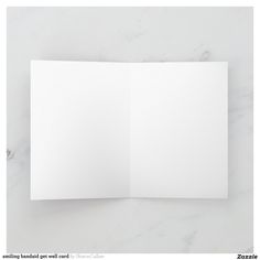 an open white paper on a marble surface