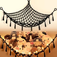 a hammock filled with stuffed animals and lights