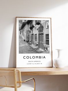 a black and white photo with the word colombia on it in front of a desk