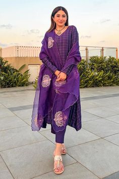 Purple silk chanderi kurta with zari embroidered checkered pattern. Comes with pant and a lotus motifs work organza dupatta.
Components: 3
Pattern: Embroidered
Type Of Work: Zari, Lotus motifs
Neckline: V Neck
Sleeve Type: Full
Fabric: Silk chanderi, Dupatta: Organza
Color: Purple
Other Details: 
Note: Jewellery worn by the model is not for sale.
Occasion: Sangeet - Aza Fashions Luxury Purple Chanderi Fabric Sets, Luxury Purple Dupatta With Printed Motifs, Luxury Purple Kurta For Eid, Luxury Purple Straight Kurta, Luxury Chanderi Unstitched Suit With Printed Motifs, Luxury Purple Cotton Silk Kurta, Luxury Churidar With Printed Motifs For Diwali, Luxury Designer Purple Kurta, Luxury Purple Designer Wear Kurta