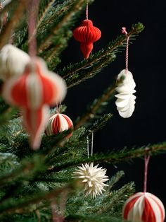 ornaments are hanging from the christmas tree