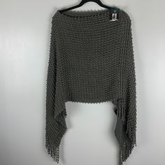 Poncho One Size Gray And Gold String Fringe At The Bottom Lightweight 100% Acrylic Cozy Good Conditions A Few Strings Are Apart On The Inside Gray Knitted One-size Sweater, Gray Knitted Sweater One Size, One-size Knitted Gray Sweater, One Size Gray Knitted Sweater, One Size Gray Knit Sweater, Gray Open Knit Tops, Casual Gray Knit Poncho, Hand Knit Poncho, Plaid Shawl