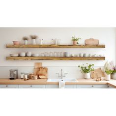 two wooden shelves above a kitchen sink filled with dishes