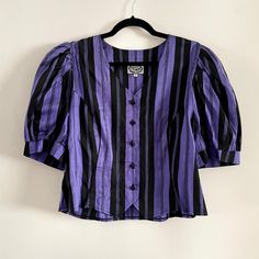 Description:  Vintage Marion Donaldson Purple & Black puff sleeve stripe button up top. Pure SilkMeasurements: B96cm  W92 cm Fitted Vertical Stripe Button-up Tops, Fitted Button-up Tops With Vertical Stripes, Striped Fitted Tops With Button Closure, Fitted Striped Tops With Button Closure, Striped Fitted Blouse With Button Closure, Fitted Striped Blouse With Button Closure, Womens Blouses, Button Up Top, Purple Black