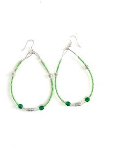 Green Beaded Hoops These earrings are super cute & made from a mix of greens, clear & India silver beads. They are lightweight and have the hook style post. Length does not include hook. Length: 3.0 in, width: 2.0 in Native Made Made in the USA. Green Small Hoop Beaded Earrings, Green Bohemian Hoop Beaded Earrings, Summer Green Beaded Hoop Earrings, Handmade Green Beaded Hoop Earrings, Nickel-free Small Hoop Green Beaded Earrings, Indian Beadwork, Beaded Hoops, Jewelry Earrings Hoops, Leather Working