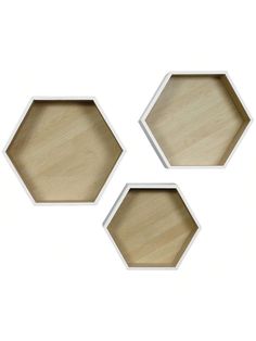 three hexagonal wooden trays sitting on top of each other in different shapes