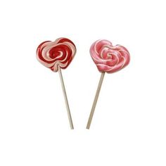 two lollipops sitting on top of each other in the shape of hearts