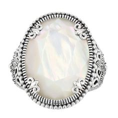 Designed with an oval-shaped mother-of-pearl center stone and marcasite accents, this Lavish by TJM sterling silver ring is a captivating accessory. Designed with an oval-shaped mother-of-pearl center stone and marcasite accents, this Lavish by TJM sterling silver ring is a captivating accessory. Additional details: mother-of-pearl and marcasite accents Metal: sterling silver Packaging: boxed Width: 0.94 in. Finish: oxidized Gemstones may have been treated to enhance their appearance. Special ca Silver Opal Ring With Gemstone Accents Oval, Elegant Silver Oval Opal Ring, White Oval Pearl Ring With Gemstone, Vintage White Oval Pearl Ring, Formal Oval Mother Of Pearl Rings, Victorian White Oval Opal Ring, Elegant White Opal Ring With Gemstone Accents, Elegant Oval Mother Of Pearl Ring, White Oval Victorian Opal Ring